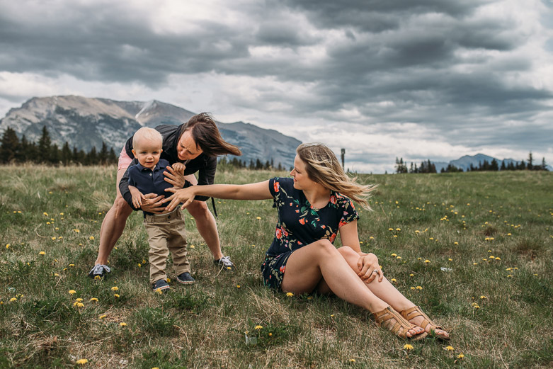 Grandmother and mother playing with child at Quarry Lake during their Canmore family photo session