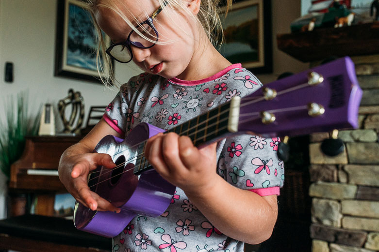 Girl playing the ukulele