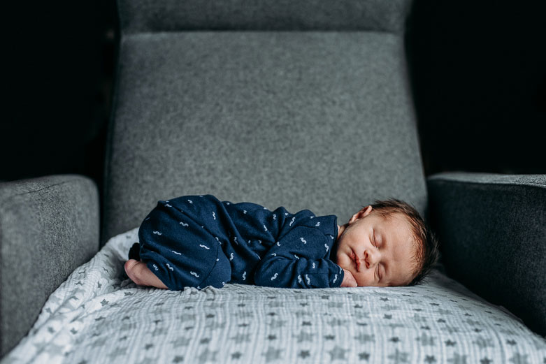 Newborn laying on couch