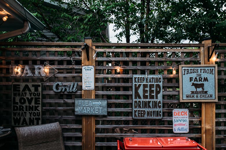 Vintage signs adorn the walls of a Sherwood Park family's deck