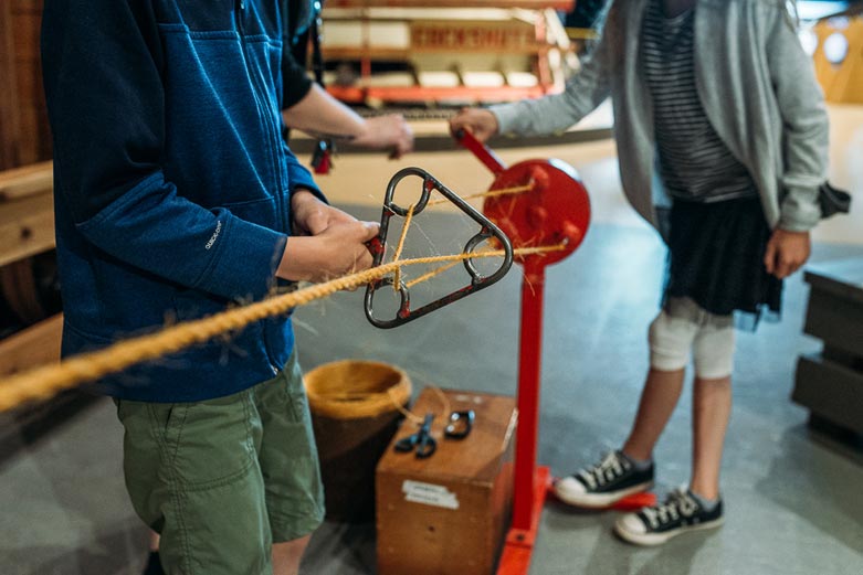 Kids making rope at the Reynolds-Alberta Museum